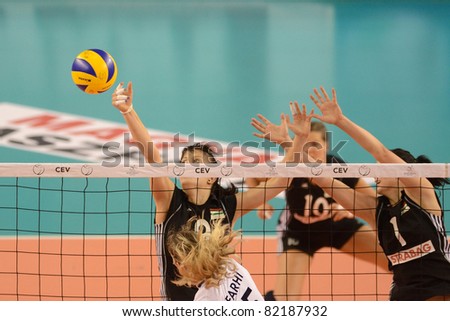DEBRECEN, HUNGARY - JULY 9: Rita Liliom (in black 1) in action a CEV European League woman's volleyball game Hungary (black) vs Israel (white) on July 9, 2011 in Debrecen, Hungary.