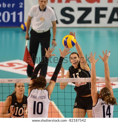 DEBRECEN, HUNGARY - JULY 9: Katalin Kiss (in black 13) in action a CEV European League woman\'s volleyball game Hungary (black) vs Israel (white) on July 9, 2011 in Debrecen, Hungary.
