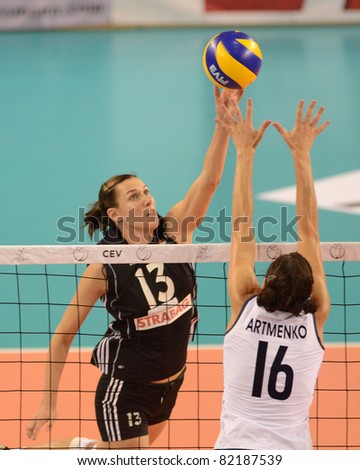 DEBRECEN, HUNGARY - JULY 9: Katalin Kiss (in black 13) in action a CEV European League woman\'s volleyball game Hungary (black) vs Israel (white) on July 9, 2011 in Debrecen, Hungary.