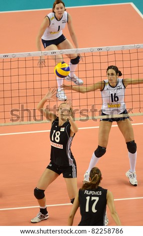 DEBRECEN, HUNGARY - JULY 9: Julia Milovits (in black 18) in action a CEV European League woman's volleyball game Hungary (black) vs Israel (white) on July 9, 2011 in Debrecen, Hungary.