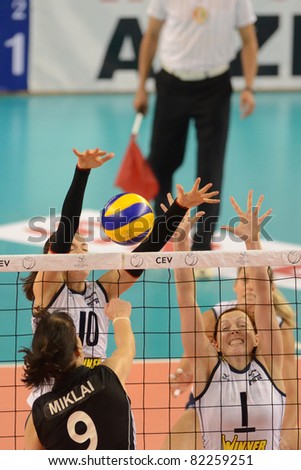 DEBRECEN, HUNGARY - JULY 9: Zsanett Miklai (in black 9) in action a CEV European League woman\'s volleyball game Hungary (black) vs Israel (white) on July 9, 2011 in Debrecen, Hungary.
