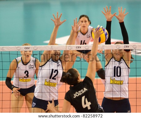 DEBRECEN, HUNGARY - JULY 9: Zsuzsanna Jozsa (in black 4) in action a CEV European League woman's volleyball game Hungary (black) vs Israel (white) on July 9, 2011 in Debrecen, Hungary.