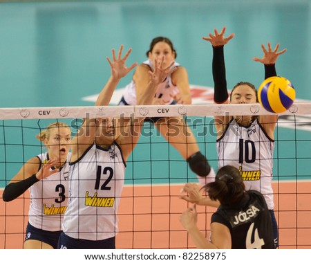 DEBRECEN, HUNGARY - JULY 9: Zsuzsanna Jozsa (in black 4) in action a CEV European League woman's volleyball game Hungary (black) vs Israel (white) on July 9, 2011 in Debrecen, Hungary.