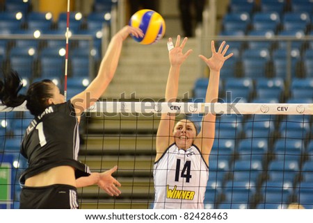 DEBRECEN, HUNGARY - JULY 9: Rita Liliom (in black 1) in action at a CEV European League woman\'s volleyball game Hungary (black) vs Israel (white) on July 9, 2011 in Debrecen, Hungary.