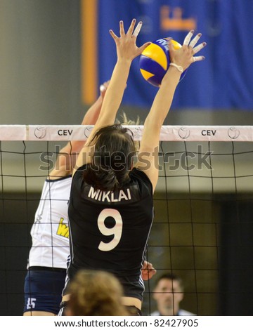 DEBRECEN, HUNGARY - JULY 9: Zsanett Miklai (in black 9) in action a CEV European League woman's volleyball game Hungary (black) vs Israel (white) on July 9, 2011 in Debrecen, Hungary.