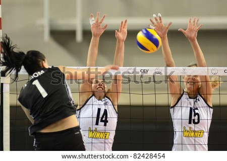 DEBRECEN, HUNGARY - JULY 9: Rita Liliom (in black 1) in action at a CEV European League woman\'s volleyball game Hungary (black) vs Israel (white) on July 9, 2011 in Debrecen, Hungary.