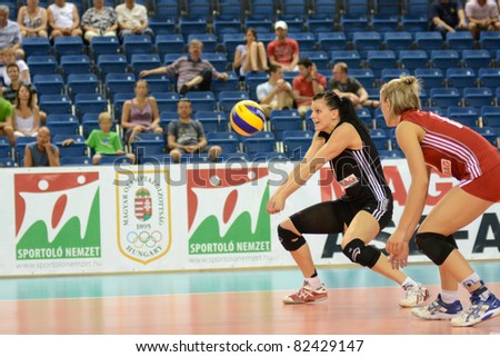 DEBRECEN, HUNGARY - JULY 9: Rita Liliom (in black) in action at a CEV European League woman\'s volleyball game Hungary (black) vs Israel (white) on July 9, 2011 in Debrecen, Hungary.