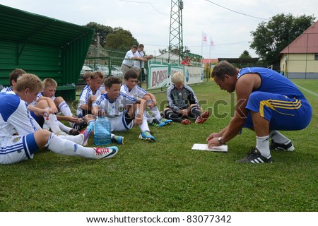 NAGYBERKI, HUNGARY - JULY 18: Ukrainian players listen to their trainer at the VII. Youth Football Festival Under 14 match Kiev (UKR) vs. Brescia Academy (ITA) July 18, 2011 in Nagyberki, Hungary