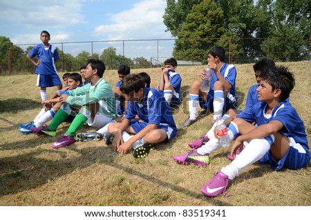 KAPOSVAR, HUNGARY - JULY 18: Unidentified Indian players listen to trainer at the VII. Youth Football Festival match Navrachana Ac. (blue) (IND) vs. Rakoczi FC (green) (HUN) on July 18, 2011 in Kaposvar, Hungary