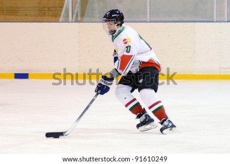 KAPOSVAR, HUNGARY - DECEMBER 17: Unidentified players in action at a friendly ice hockey match with Hungarian (white) and Italian (blue) Under 16 National Team, December 17, 2011 in Kaposvar, Hungary.