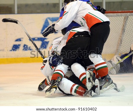 KAPOSVAR, HUNGARY - DECEMBER 17: Hungarian players celebrate at a friendly ice hockey match with Hungarian (white) and Italian (blue) Under 16 National Team, December 17, 2011 in Kaposvar, Hungary.