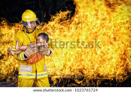 firefighter., rescue fireman save a child from fire incident.