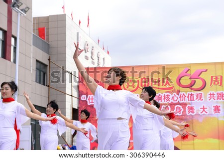 Luannan - September 29: collective dance woman individual performances of close-up in shopping square, on September 29, 2014, the south of the luanhe river, hebei, China.