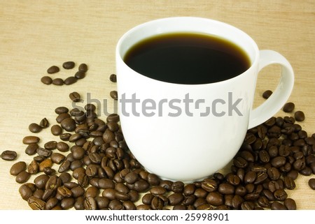 coffee cup with beans and a smiley face