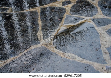 black wet granite tiles with water drops pile of granite texture - marble layers design gray stone slab surface grain rock backdrop layout