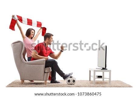 Euphoric soccer fans watching football on television isolated on white background