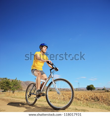 View of a biker riding a mountain bike outdoor