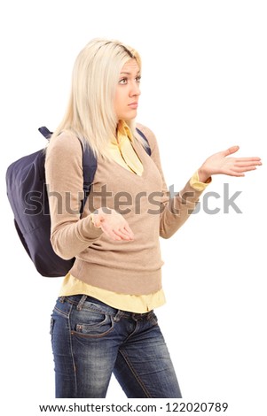 A blond female student with backpack gesturing - I do not know