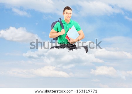 Young male student with school bag and notebooks sitting on a cloud