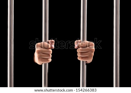 Male Hands Holding Prison Bars Isolated On Black Background