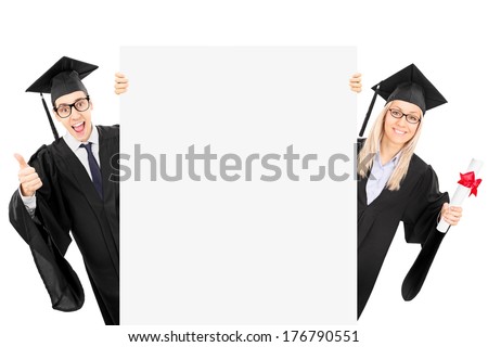 Two college students standing behind blank panel and gesturing success isolated on white background