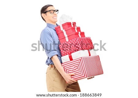 Man carrying a heavy load of gifts isolated on white background