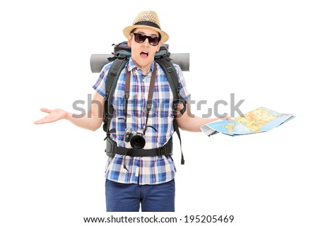 Lost male tourist holding a map and gesturing with hands isolated on white background