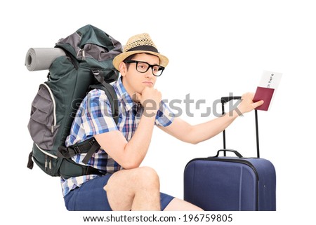 Worried male tourist holding passport and waiting isolated on white background