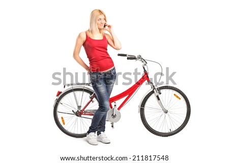 Woman talking on phone and standing by a bike isolated on white background