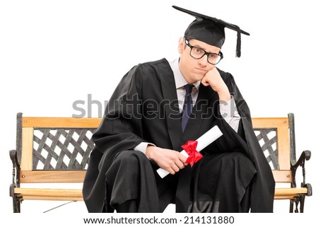 Angry college graduate holding a diploma isolated against white background