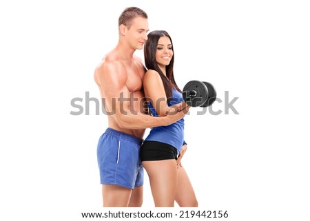 Fitness coach exercising with a female athlete with a barbell isolated on white background