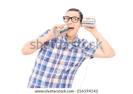 Silly man talking to himself through tin can phone isolated on white background