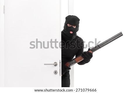 Masked terrorist entering a room and holding a shotgun rifle isolated on white background