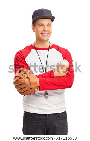 Studio shot of a young man with a baseball glove holding a baseball and wearing a whistle around his neck isolated on white background