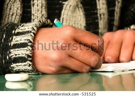 A third-world country student writing his homework