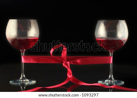 Two wine glasses wrapped with a tape