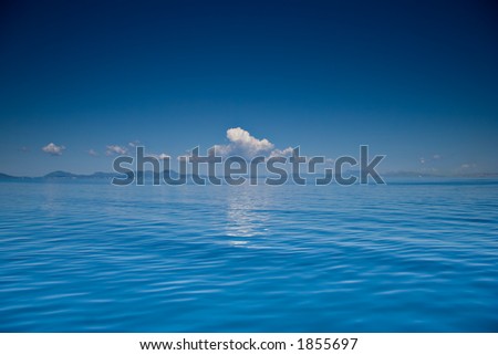 View of an open sea with a cloud on Corfu island, Greece