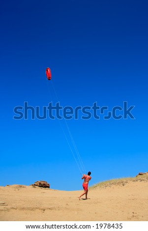 Person flying a kite at the beach in Corfu, Greece