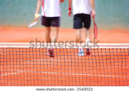 Never give up-Two tennis players leaving the tennis court