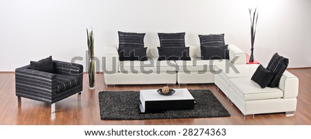 A modern minimalist living-room with white furniture