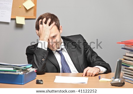 Sad worker in an office