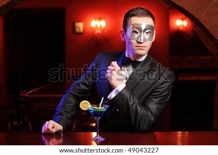 A man with a mask on a counter bar