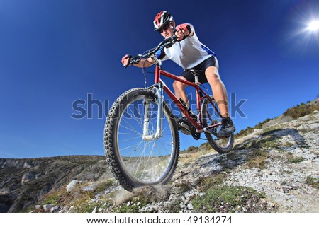 Person riding a bike downhill style