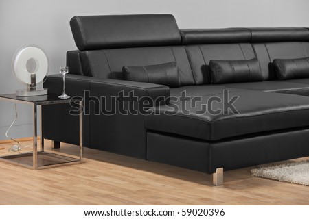 A studio shot of a black leather furniture