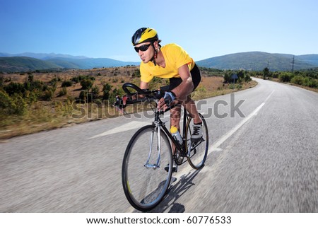Cyclist riding a bike on an open road