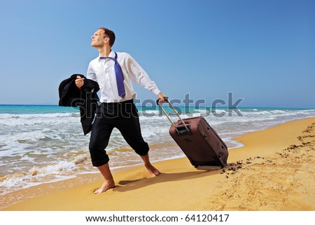 Full length portrait of a lost businessman carrying a suitcase at the beach