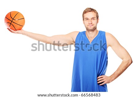 Young basketball player holding a basketball isolated on white background