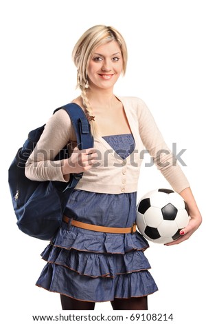 A female high school student wearing school bag and holding a football isolated on white background