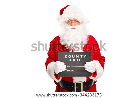 Studio shot of a criminal Santa Claus posing for a mug shot with a black board in his hand isolated on white background