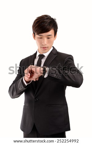 Young Asian business man check his watch
